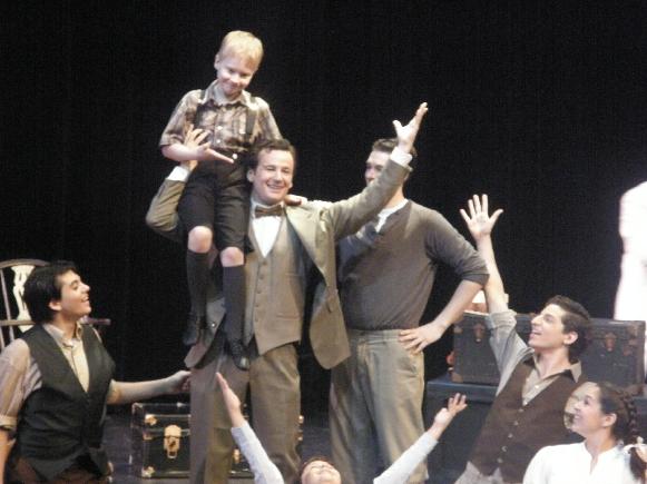 Ryan Foy, with Alexander Craven on his shoulder, in a scene from "The Seven Little Foys"